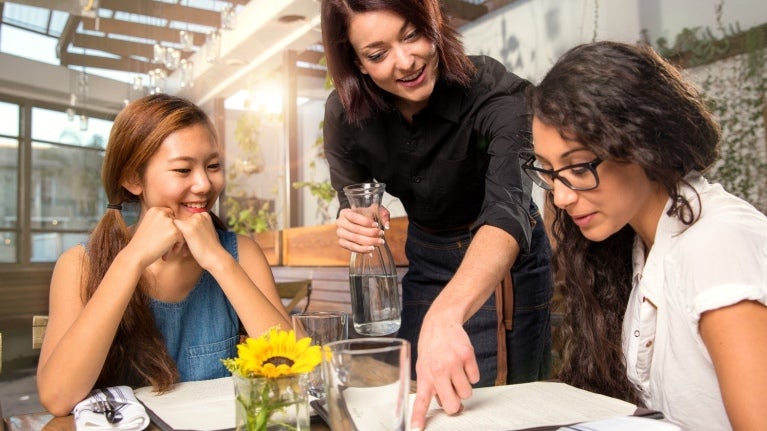 customers ordering food at restaurant