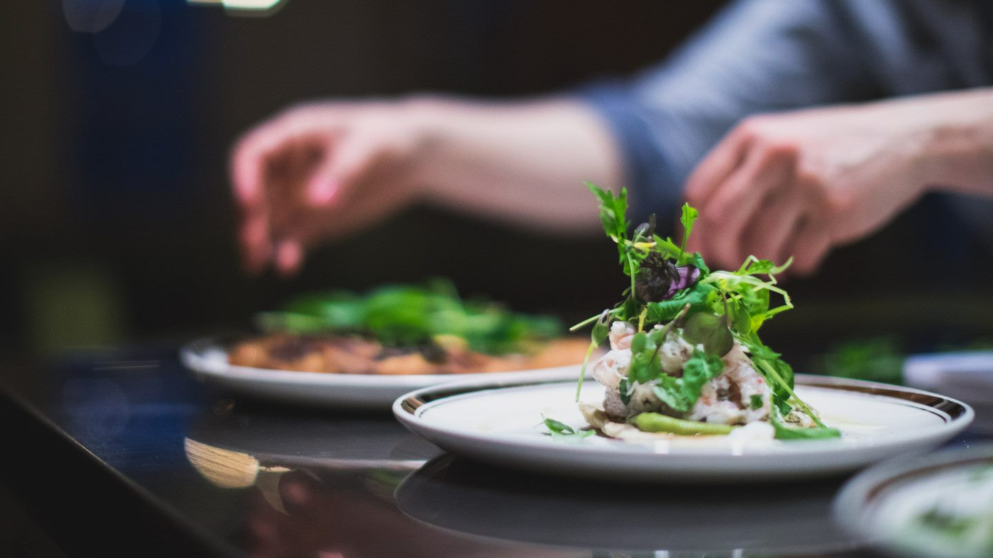 chef garnishing plates